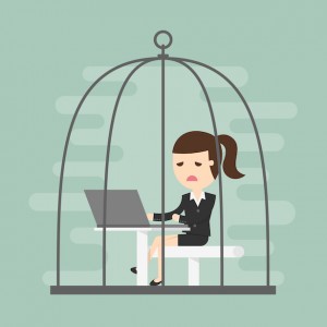 Bored business woman working in birdcage